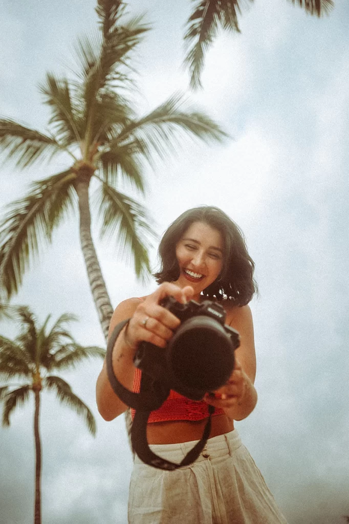 Gold Coast portrait photographer in front of palm trees